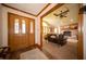 Open-concept living area with hardwood floors and a view of the living room fireplace at 7732 Ashtree Dr, Indianapolis, IN 46259