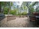 Outdoor living space features a gas grill, fire pit, and patio seating at 7732 Ashtree Dr, Indianapolis, IN 46259