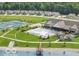Breathtaking aerial view showcases a community pool, tennis court, clubhouse and lake at 811 Harley Ln, Westfield, IN 46074