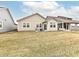 Extensive backyard with manicured lawn, patio, and seating area for outdoor enjoyment at 811 Harley Ln, Westfield, IN 46074