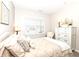 Bright bedroom featuring a cozy bed with stylish pillows, a decorative frame, and a classic white dresser at 811 Harley Ln, Westfield, IN 46074