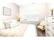 Cozy bedroom with a comfortable bed, stylish pillows, a decorative frame, and a white dresser at 811 Harley Ln, Westfield, IN 46074