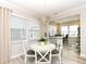 Bright dining room features a modern chandelier and a glass table with white chairs at 811 Harley Ln, Westfield, IN 46074