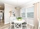 Bright dining room features a modern chandelier and a glass table with white chairs at 811 Harley Ln, Westfield, IN 46074