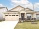 Charming one-story home with a two-car garage, cozy front porch, and beautifully landscaped front yard at 811 Harley Ln, Westfield, IN 46074