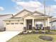 Charming one-story home with a two-car garage, cozy front porch, and beautifully landscaped front yard at 811 Harley Ln, Westfield, IN 46074