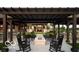 Inviting outdoor space with a charming fire pit and ample seating under a covered pergola at 811 Harley Ln, Westfield, IN 46074