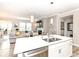 Modern kitchen with white cabinets, stainless steel appliances, an island, and an open floor plan at 811 Harley Ln, Westfield, IN 46074