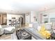 Open concept living space featuring a kitchen with island, a dining area, and a comfortable living room at 811 Harley Ln, Westfield, IN 46074