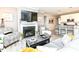 Cozy living room with a fireplace, comfortable seating, and open access to the modern kitchen at 811 Harley Ln, Westfield, IN 46074
