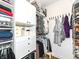 Organized walk-in closet with built-in shelving, rods, drawers and shoe rack for efficient storage at 811 Harley Ln, Westfield, IN 46074