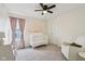 Cozy Bedroom with a crib, rocking chair, modern decor and soft natural light at 8818 Tributary Dr, Indianapolis, IN 46259
