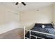 Bedroom featuring ceiling fan, closet and plush carpet with a full size bed at 8818 Tributary Dr, Indianapolis, IN 46259