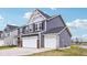 Home with gray siding, two car garage, brick trim, and a well maintained lawn at 8818 Tributary Dr, Indianapolis, IN 46259