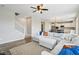 Open-concept living area showcasing a large sectional sofa and seamless flow to the kitchen at 8818 Tributary Dr, Indianapolis, IN 46259