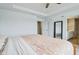 Spacious bedroom with tray ceiling, light carpet and large mirror and access to ensuite bath at 8818 Tributary Dr, Indianapolis, IN 46259