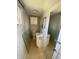 Small bathroom featuring tiled floors, a compact vanity, and a medicine cabinet at 925 E Main St, Muncie, IN 47305