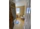 Bathroom with tiled floors, a shower-tub, and a window for natural light at 925 E Main St, Muncie, IN 47305