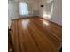 Bedroom featuring hardwood floors, windows, and a bright, airy atmosphere at 925 E Main St, Muncie, IN 47305