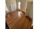 Bright bedroom featuring hardwood floors, a large window, and natural light at 925 E Main St, Muncie, IN 47305