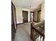 Hallway with wood trim, doors, and staircase leading to upper floors at 925 E Main St, Muncie, IN 47305