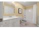 Bright bathroom features a shower-tub combo, large mirror, and single sink vanity with ample storage space at 999 Box Turtle Ct, Columbus, IN 47201