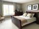 Relaxing bedroom featuring a dresser and queen sized sleigh bed at 999 Box Turtle Ct, Columbus, IN 47201