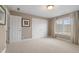 A large bedroom with carpeted floors and many closets at 999 Box Turtle Ct, Columbus, IN 47201