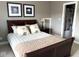 Bedroom featuring a sleigh bed and a doorway that leads to a bathroom at 999 Box Turtle Ct, Columbus, IN 47201