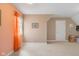 Bright bedroom with neutral walls, showing a window with curtains, a door, and unique wall decor at 999 Box Turtle Ct, Columbus, IN 47201