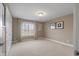 An empty bedroom with carpeted floors and a large window at 999 Box Turtle Ct, Columbus, IN 47201