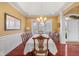 Elegant dining room with large window and a chandelier at 999 Box Turtle Ct, Columbus, IN 47201