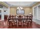 Dining room with hardwood floors and a large dining table set for a dinner at 999 Box Turtle Ct, Columbus, IN 47201