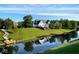 Beautiful waterfront home with lush green lawn and a charming dock at 999 Box Turtle Ct, Columbus, IN 47201