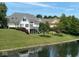 Spacious home featuring a deck overlooking a serene waterfront at 999 Box Turtle Ct, Columbus, IN 47201