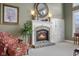 Close-up of the stone fireplace with white mantle and decorative accents at 999 Box Turtle Ct, Columbus, IN 47201