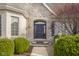 Charming front entryway with stone facade and beautiful landscaping at 999 Box Turtle Ct, Columbus, IN 47201