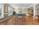 Game room includes large windows, hard wood floors and recessed lighting, offering a great space for leisure activities at 999 Box Turtle Ct, Columbus, IN 47201
