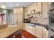 Kitchen with ample cabinetry, granite countertops, large island, and stainless steel appliances at 999 Box Turtle Ct, Columbus, IN 47201