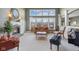 Bright living room with large windows, fireplace, and comfortable seating at 999 Box Turtle Ct, Columbus, IN 47201
