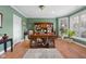 Cozy home office featuring an executive desk, built-in bookcase, large windows, and natural light at 999 Box Turtle Ct, Columbus, IN 47201