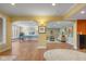 Open-concept recreation area features hard wood flooring, recessed lighting, and an adjacent lounge area at 999 Box Turtle Ct, Columbus, IN 47201
