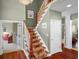 Spacious foyer with hardwood floors, stairs and an open doorway at 999 Box Turtle Ct, Columbus, IN 47201