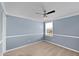 Clean and bright bedroom with neutral walls, plush carpeting, and a ceiling fan at 10432 Dark Star Dr, Indianapolis, IN 46234
