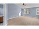 Spacious bedroom with plush carpeting, light blue walls, and great natural light at 10432 Dark Star Dr, Indianapolis, IN 46234