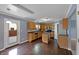 Bright kitchen boasts stainless steel appliances, wood cabinets, an island, and great outdoor access at 10432 Dark Star Dr, Indianapolis, IN 46234