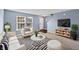 Bright living room with large windows, stylish furniture, and modern decor at 10432 Dark Star Dr, Indianapolis, IN 46234