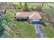 Aerial shot of home with a driveway, lush lawn, and mature trees surrounding the property at 110 Jordan Ct, Martinsville, IN 46151