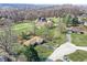 Spacious property featuring a home, lush green lawn, and surrounding trees from an aerial perspective at 110 Jordan Ct, Martinsville, IN 46151