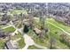 Stunning aerial view of property, highlighting its lush greenery, mature trees, and quiet neighborhood at 110 Jordan Ct, Martinsville, IN 46151
